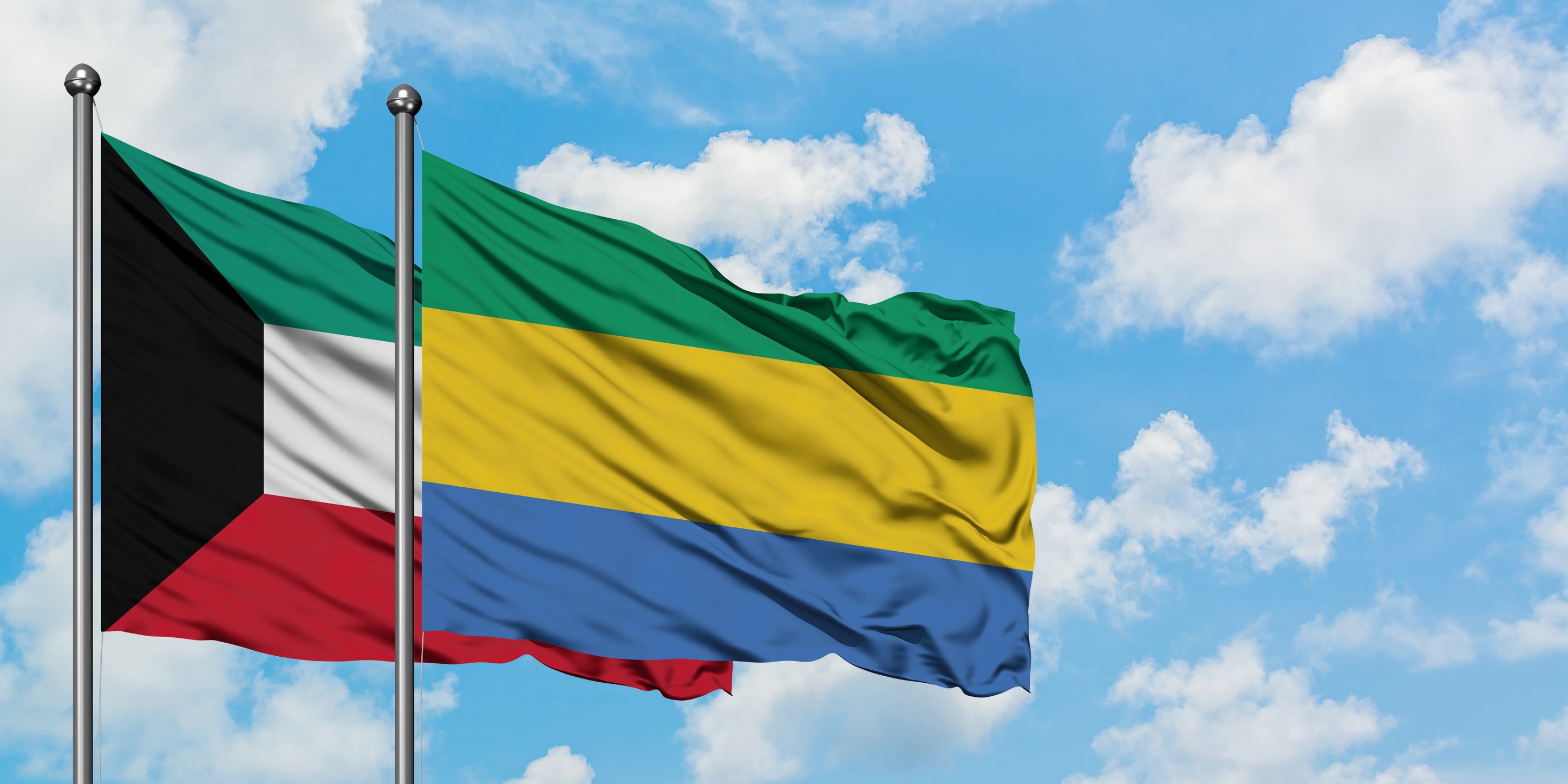Kuwait And Gabon Flag Waving In The Wind
