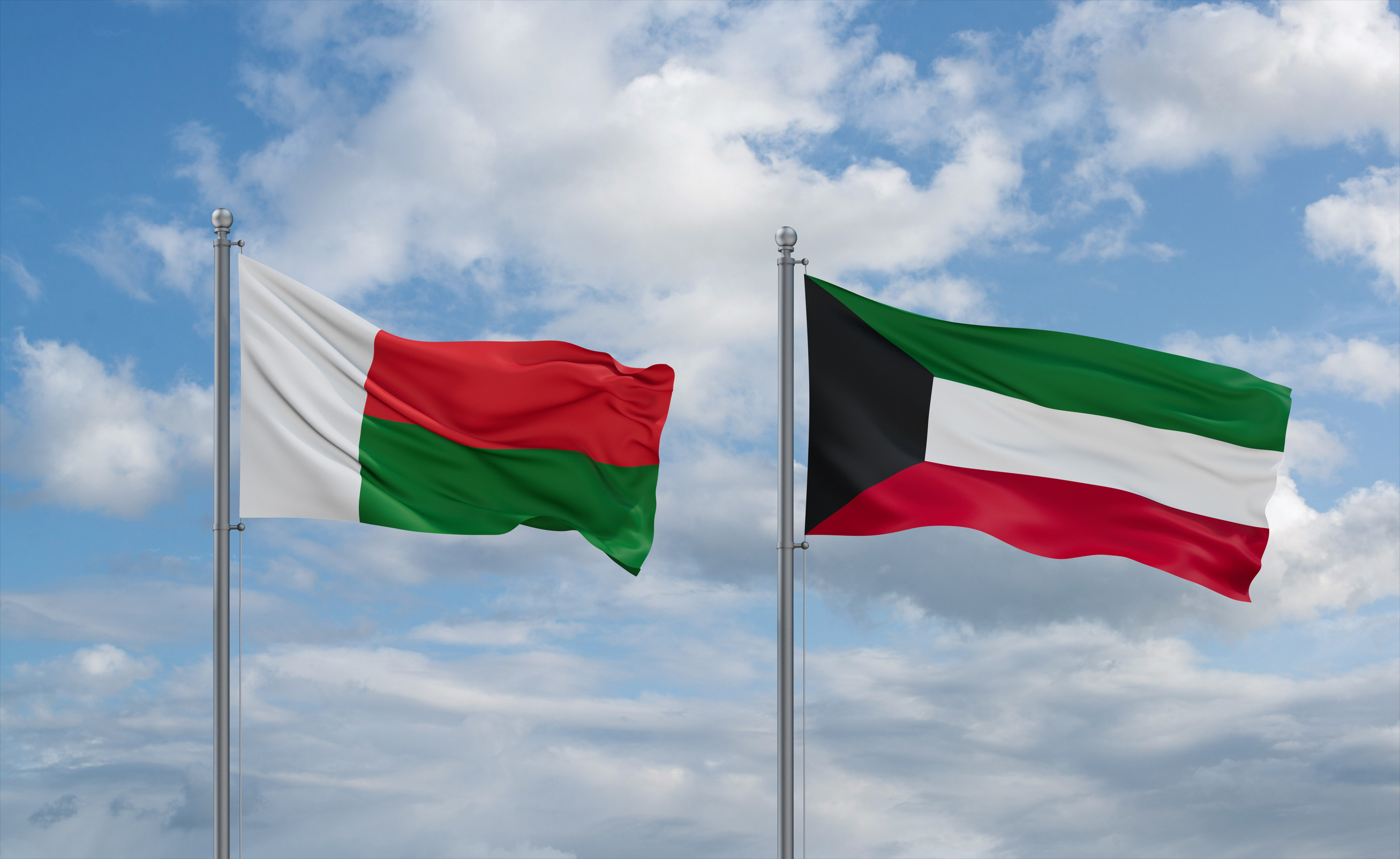 Kuwait And Madagascar Flags Waving Together