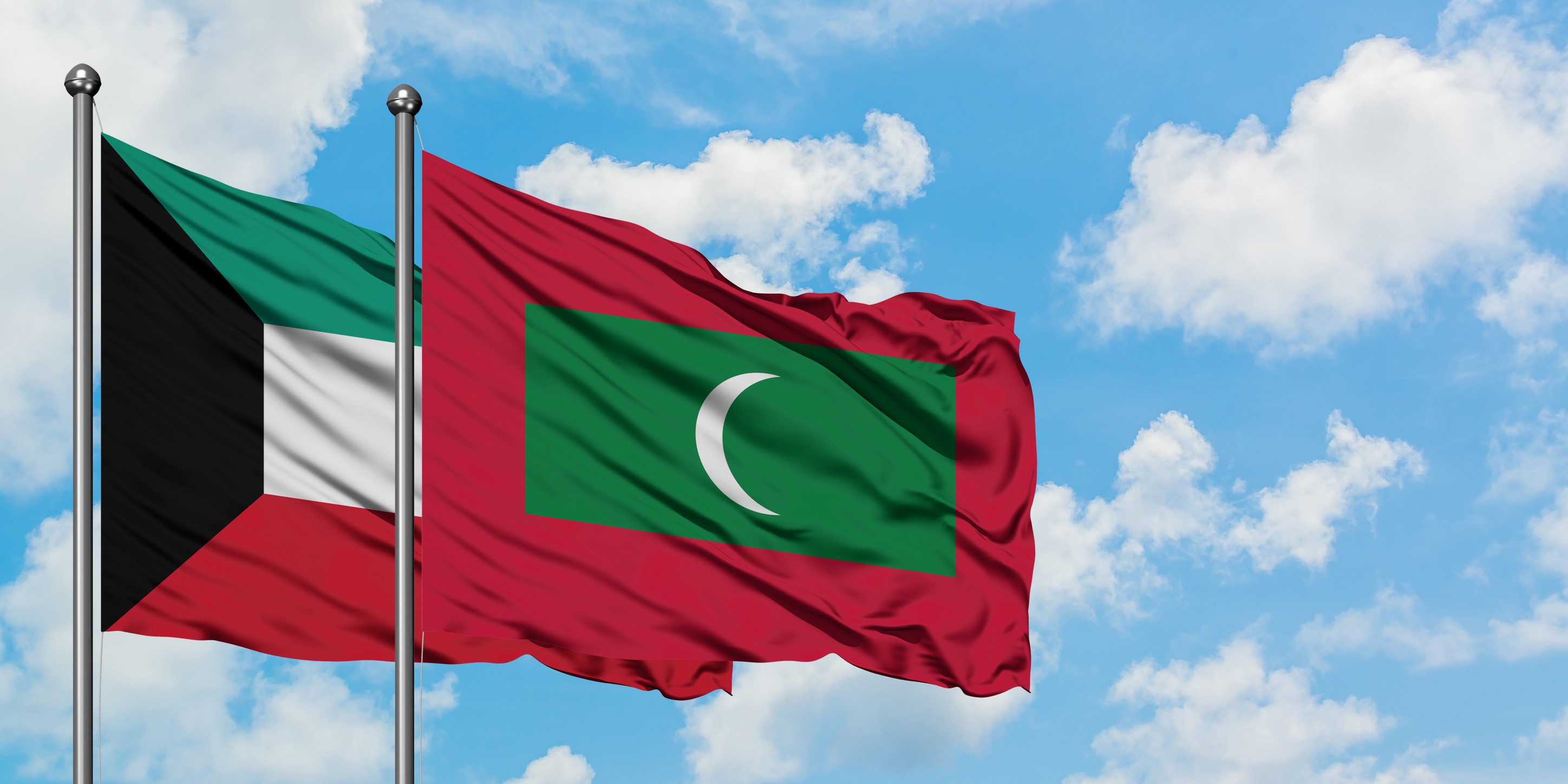 Kuwait And Maldives Flag Waving In The Wind Against White