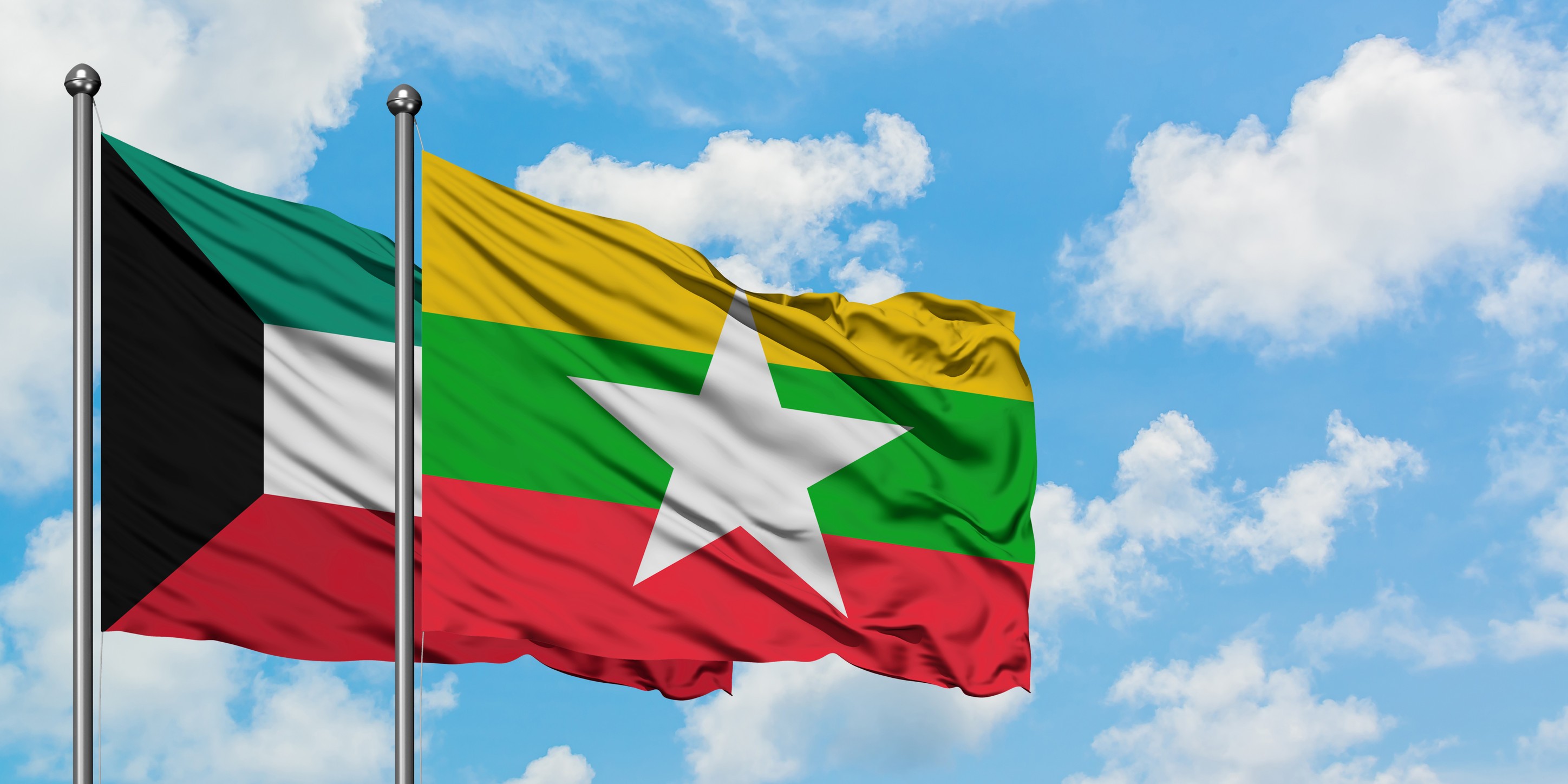 Kuwait And Myanmar Flag Waving In The Wind