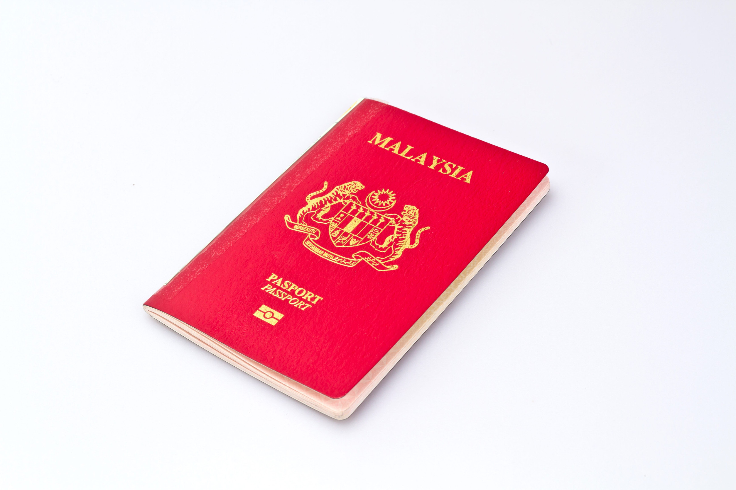 Malaysian passport on white background
