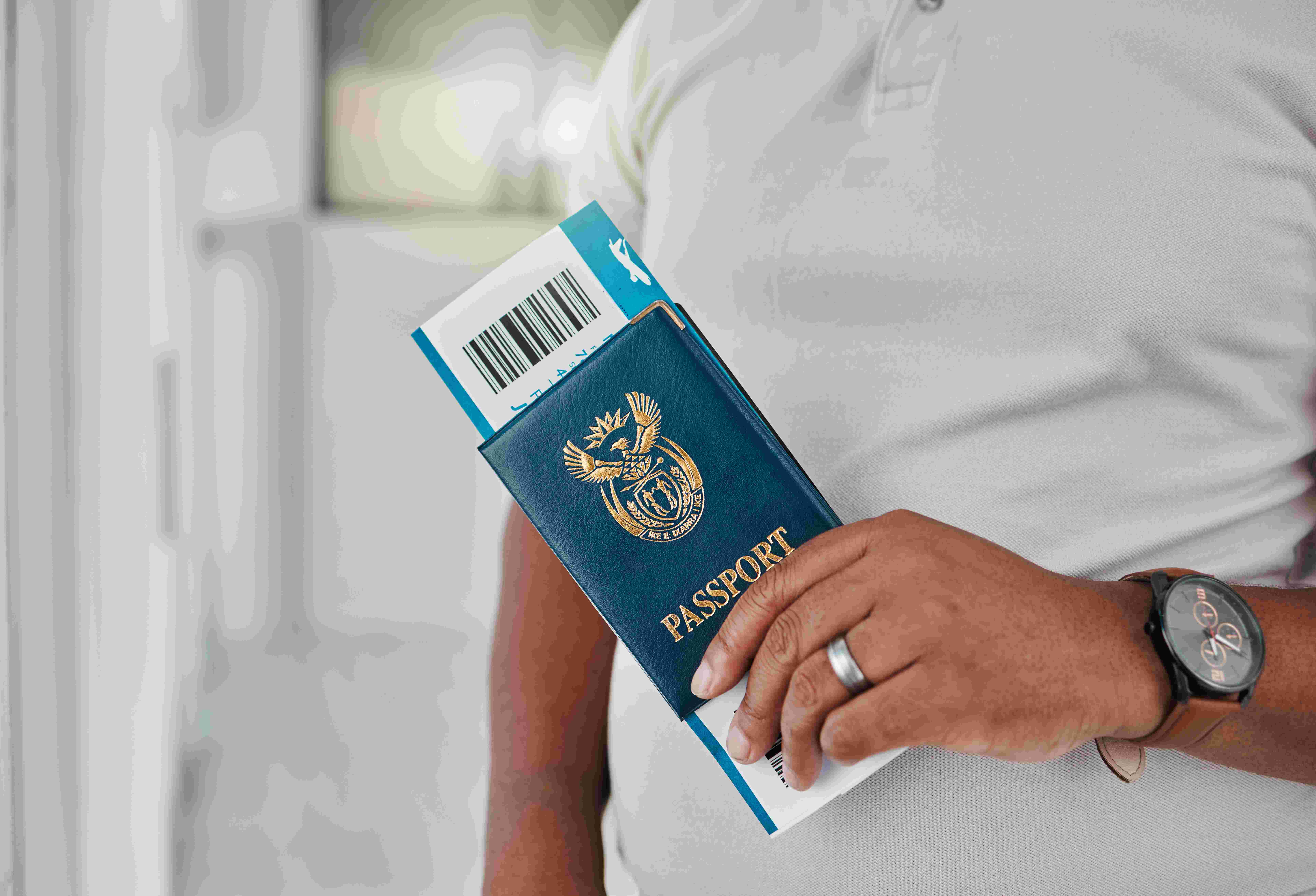 Man At Airport With Passport
